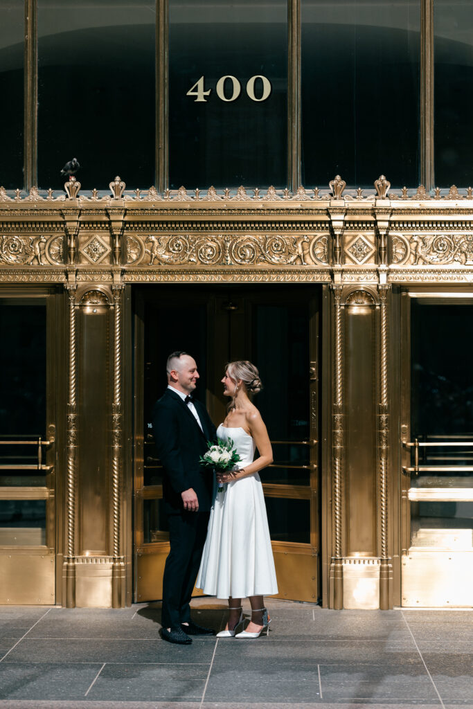 elopement wedding portrait outside of the wrigley building in downtown chicago